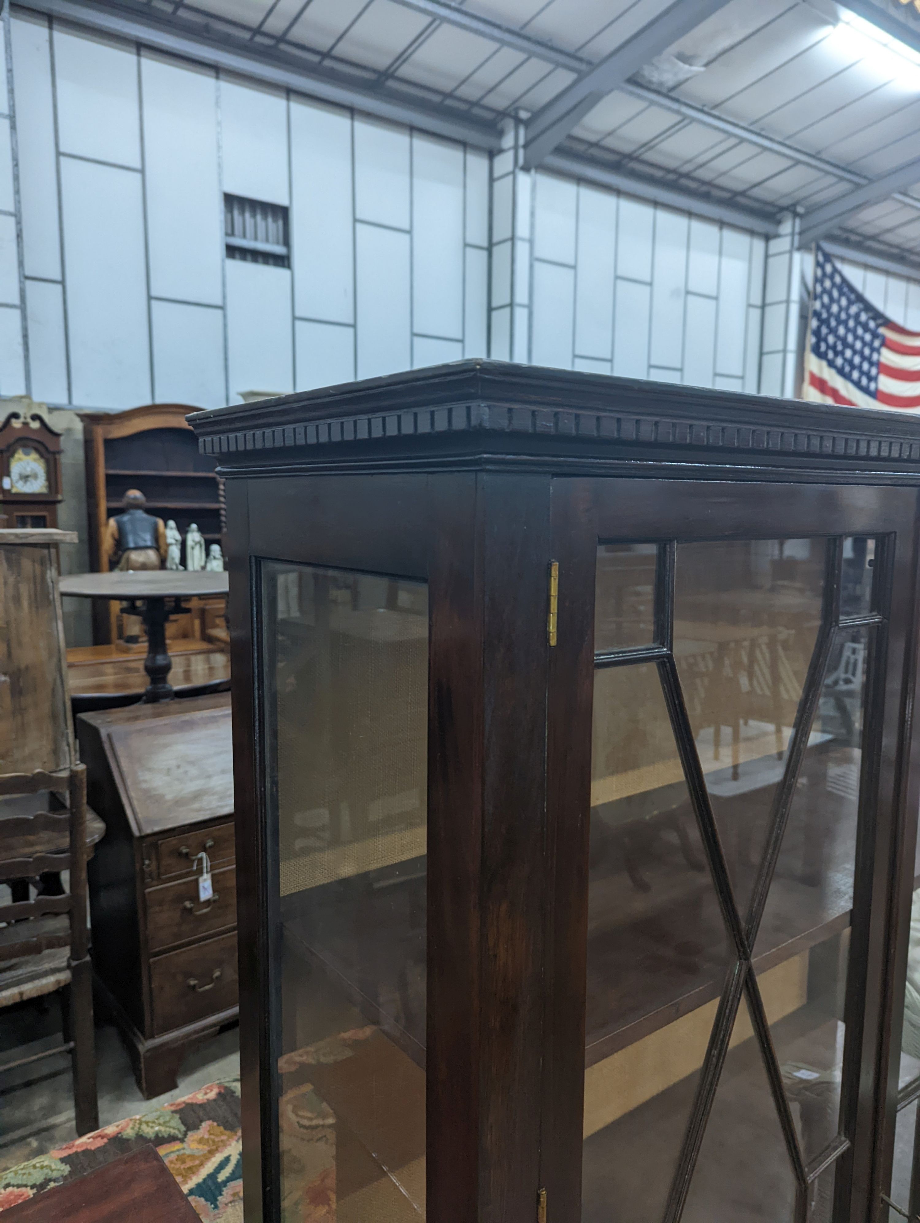 A reproduction George III style glazed mahogany two door display cabinet, width 108cm, depth 40cm, height 172cm